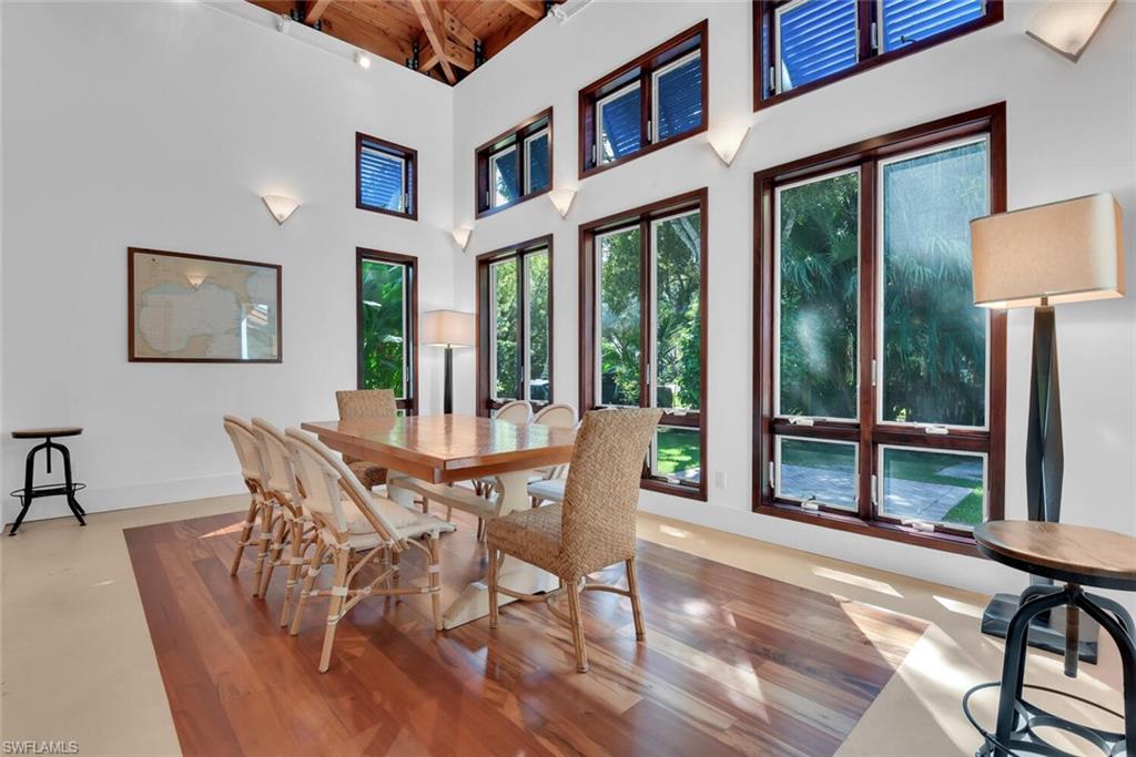 795 18th Avenue South Naples, FL 34102 - Photo 6 of 48 a dining room with furniture window and wooden floor