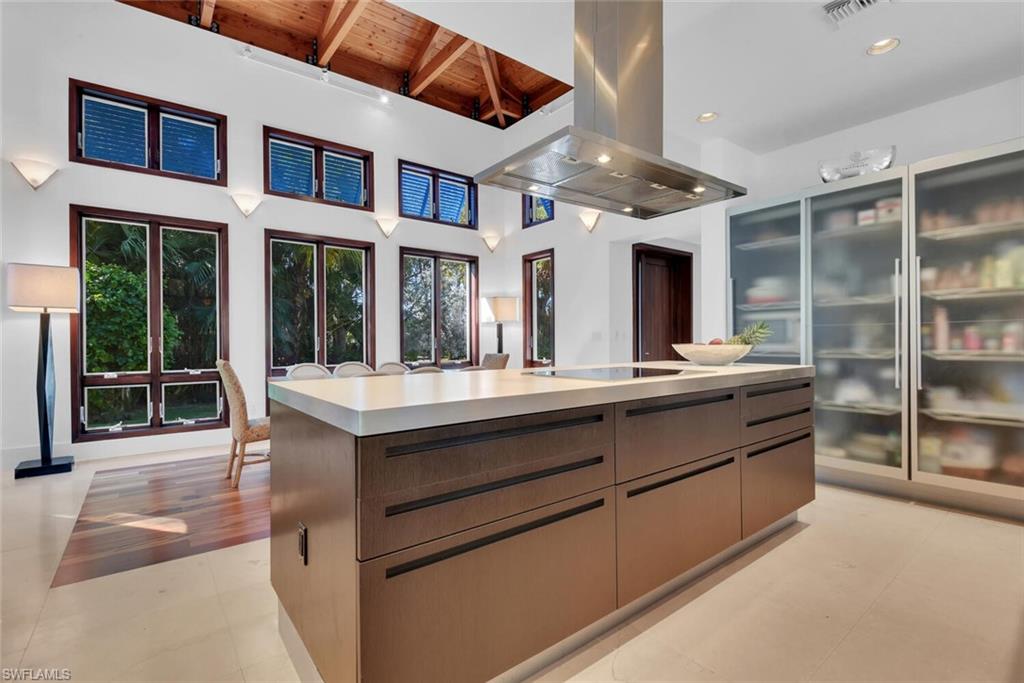 795 18th Avenue South Naples, FL 34102 - Photo 10 of 48 a kitchen with stainless steel appliances granite countertop a oven and a large window