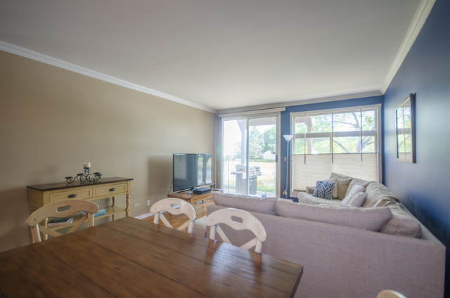 963 Ripple Ridge Cove, Unit 963 Darien, IL 60561 - Photo 3 of 15 a bedroom with a bed and wooden floor