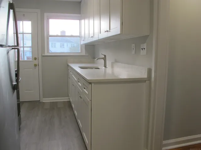 a kitchen with a sink and a window