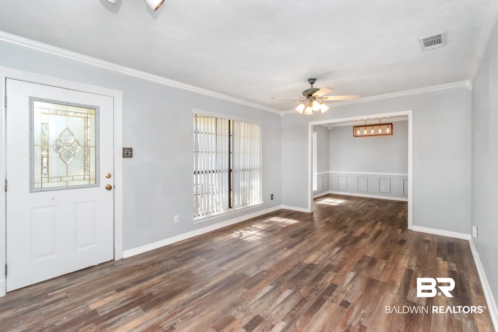 8304 Champlain Circle Mobile, AL 36695 - Photo 2 of 46 Foyer with dark wood-type flooring, ornamental molding, and ceiling fan