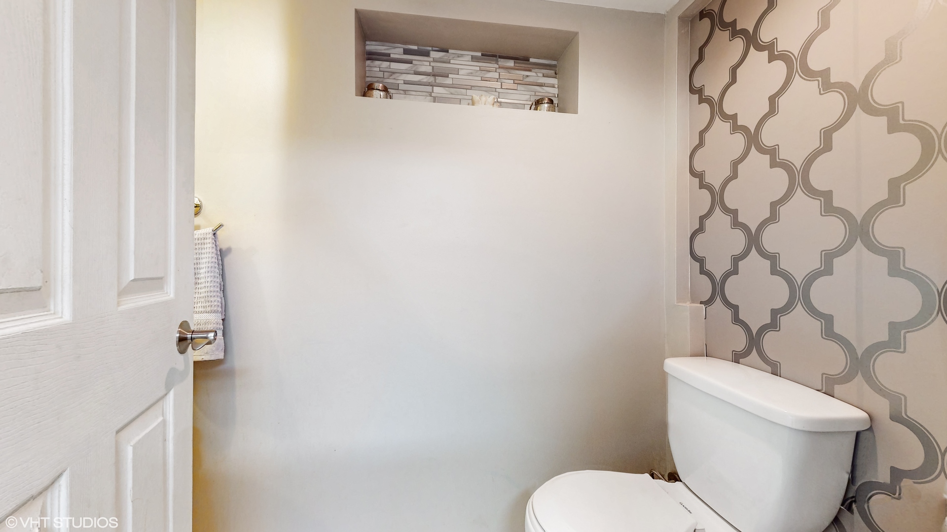 453 High Ridge Road Hillside, IL 60162 - Photo 16 of 20 a white toilet sitting next to a shower curtain