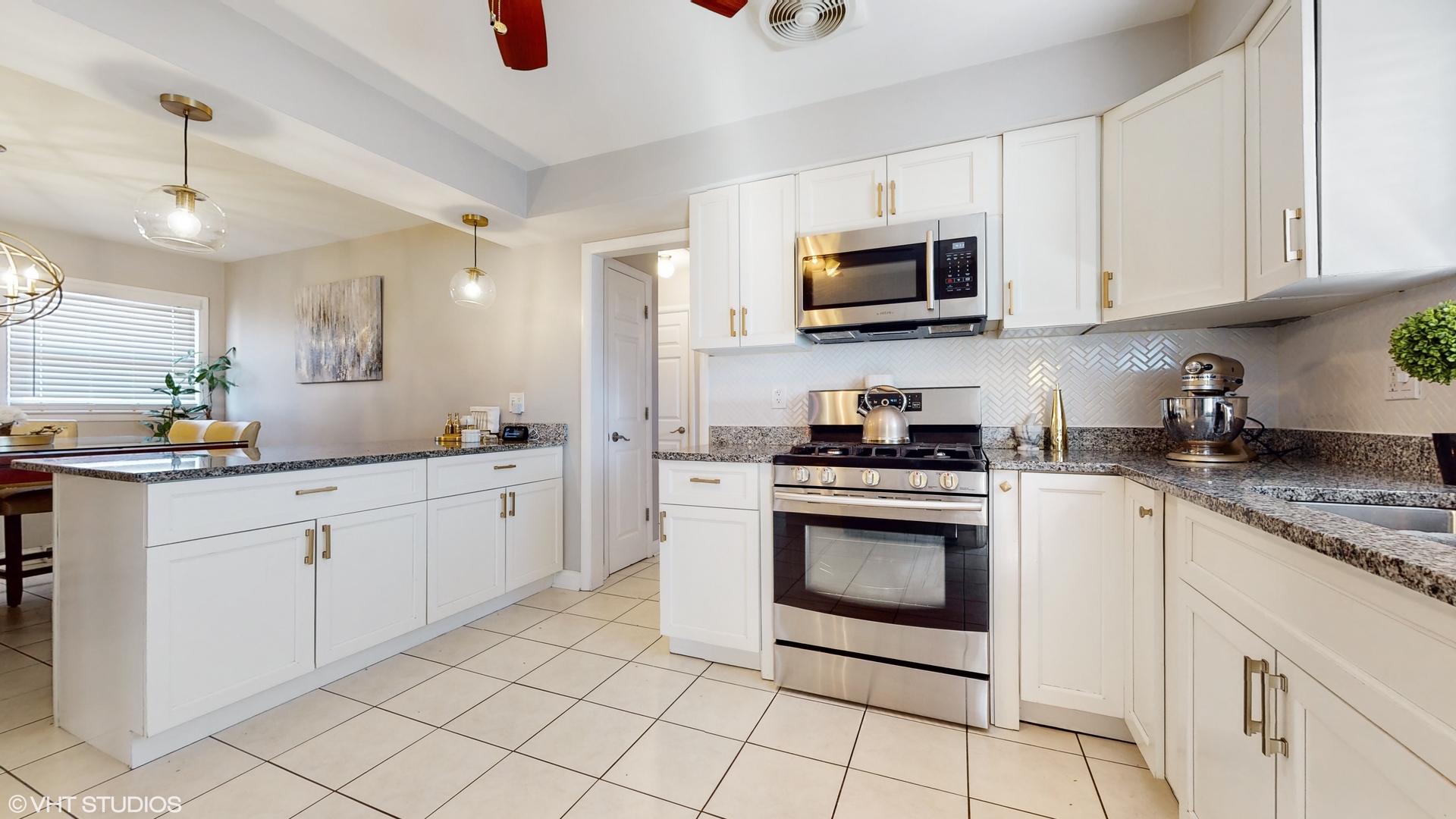 453 High Ridge Road Hillside, IL 60162 - Photo 6 of 20 a kitchen with white cabinets stainless steel appliances and sink