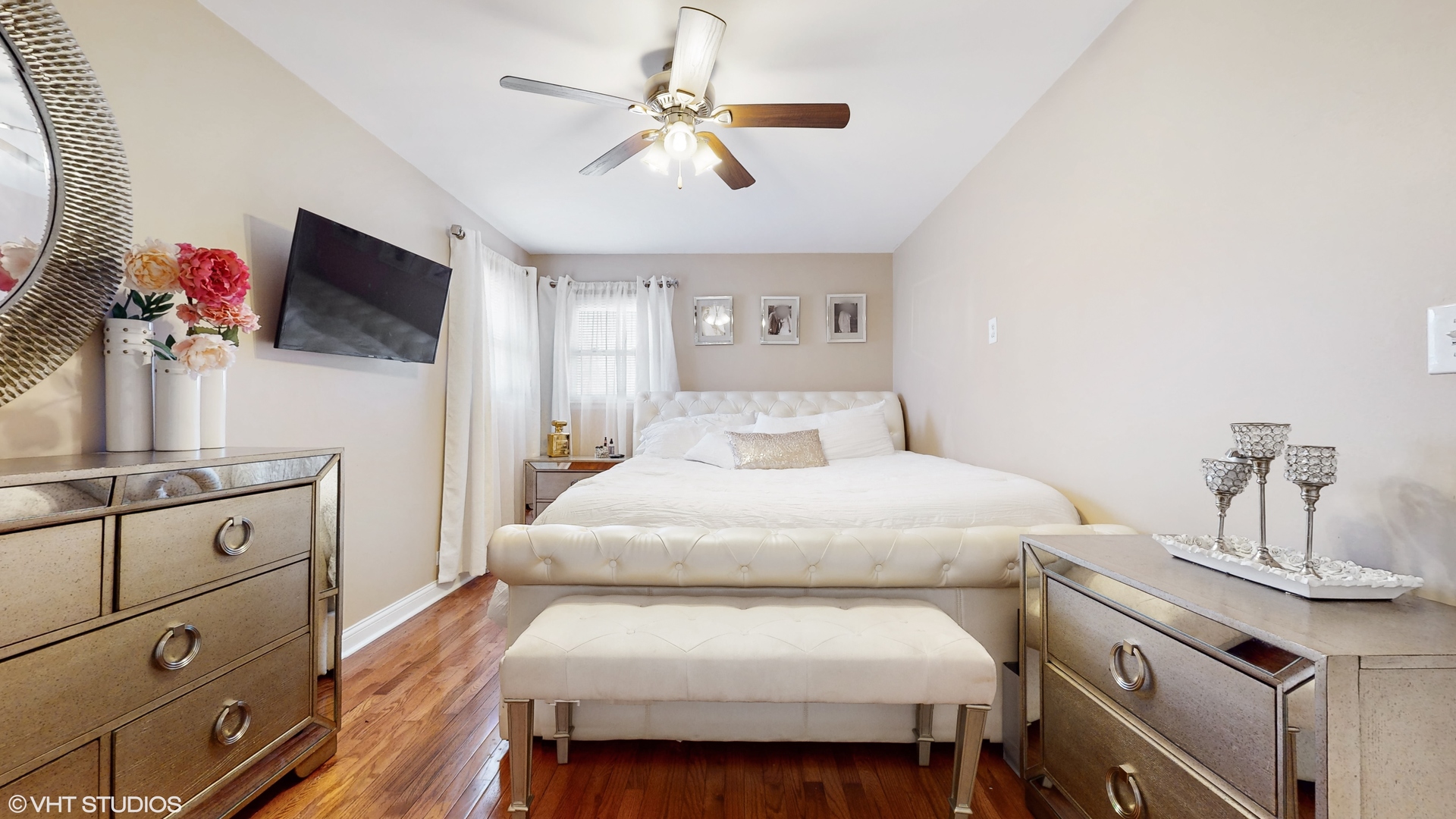 453 High Ridge Road Hillside, IL 60162 - Photo 10 of 20 a bedroom with a large bed and a flat tv screen on dresser