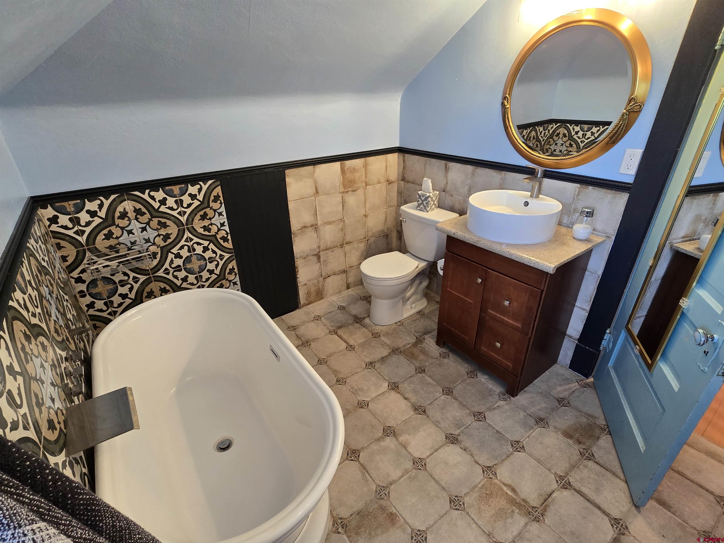 39778 Pitkin Road Paonia, CO 81428 - Photo 21 of 45 a bathroom with a bathtub and mirror