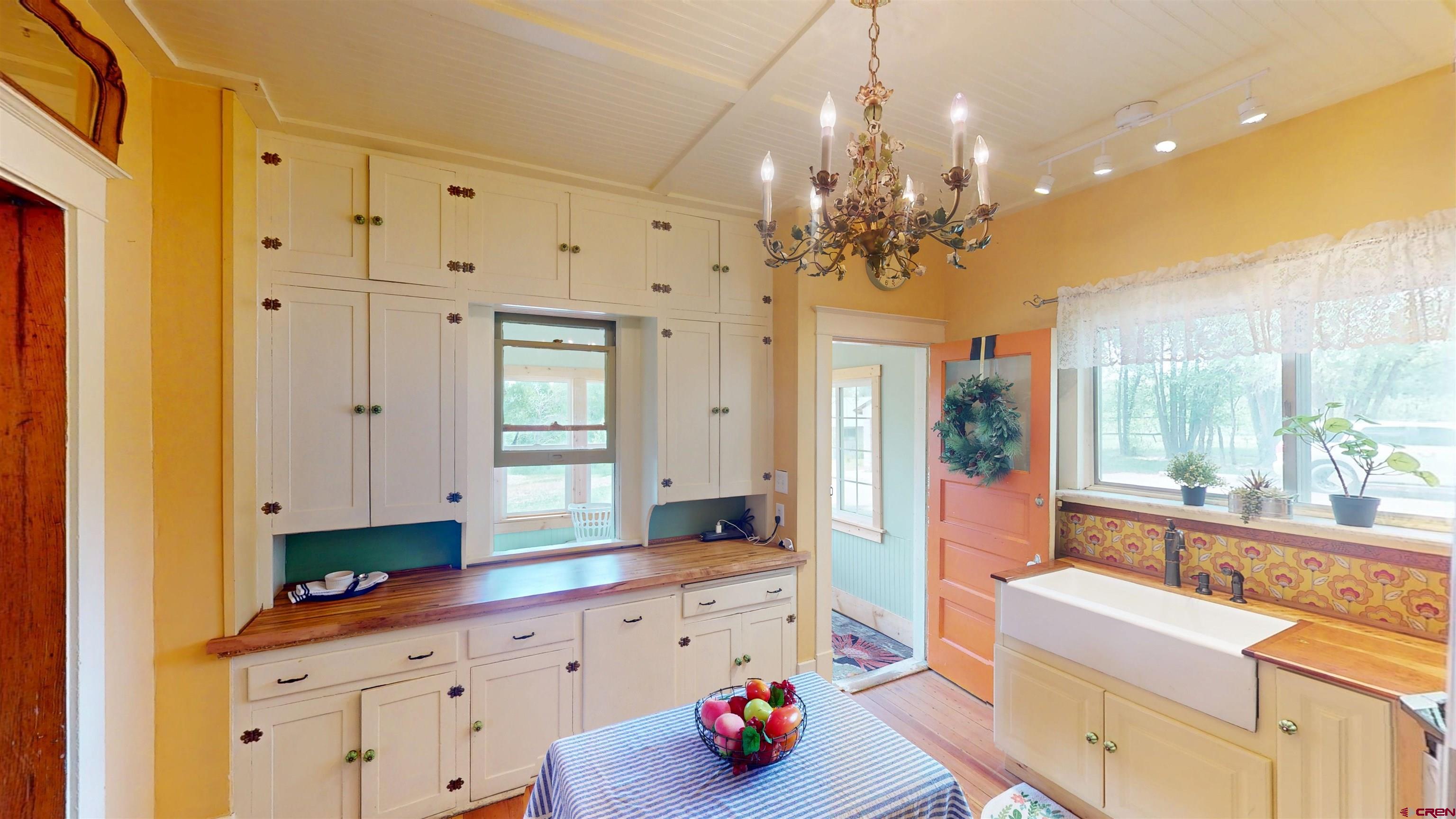 39778 Pitkin Road Paonia, CO 81428 - Photo 3 of 45 a large white kitchen with a large window