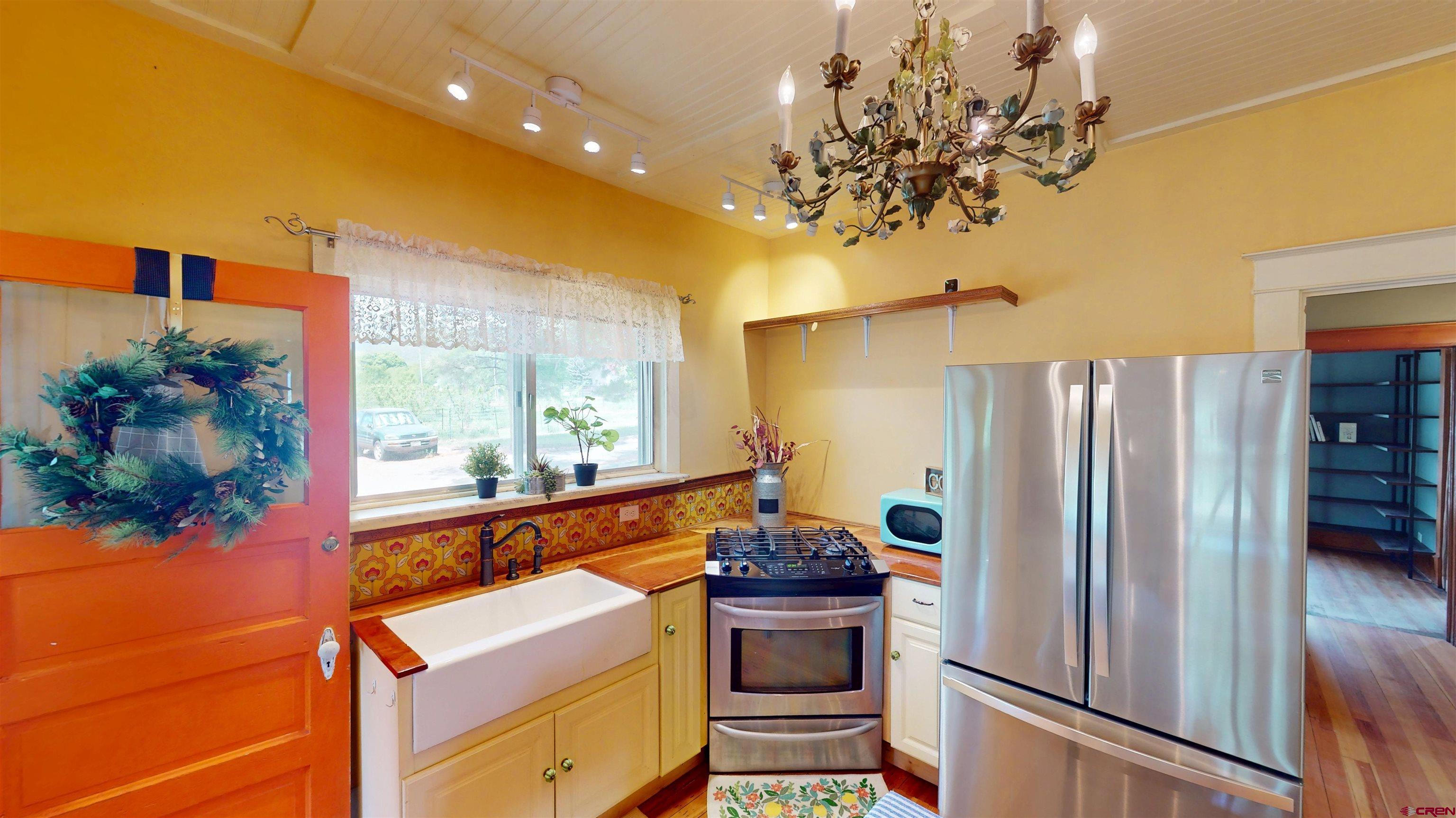39778 Pitkin Road Paonia, CO 81428 - Photo 4 of 45 a kitchen with stainless steel appliances granite countertop a refrigerator and a sink