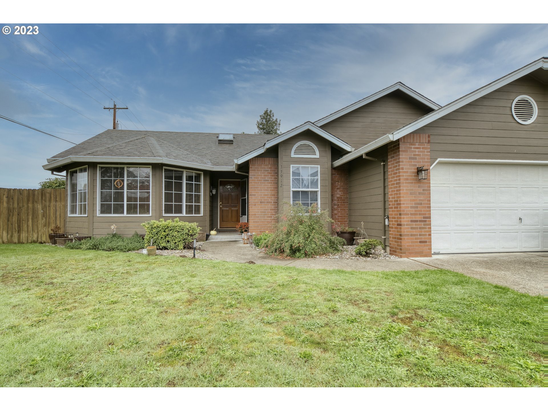 33912 Southeast Everett Way Scappoose, OR 97056 - Photo 1 of 32 a front view of a house with a yard