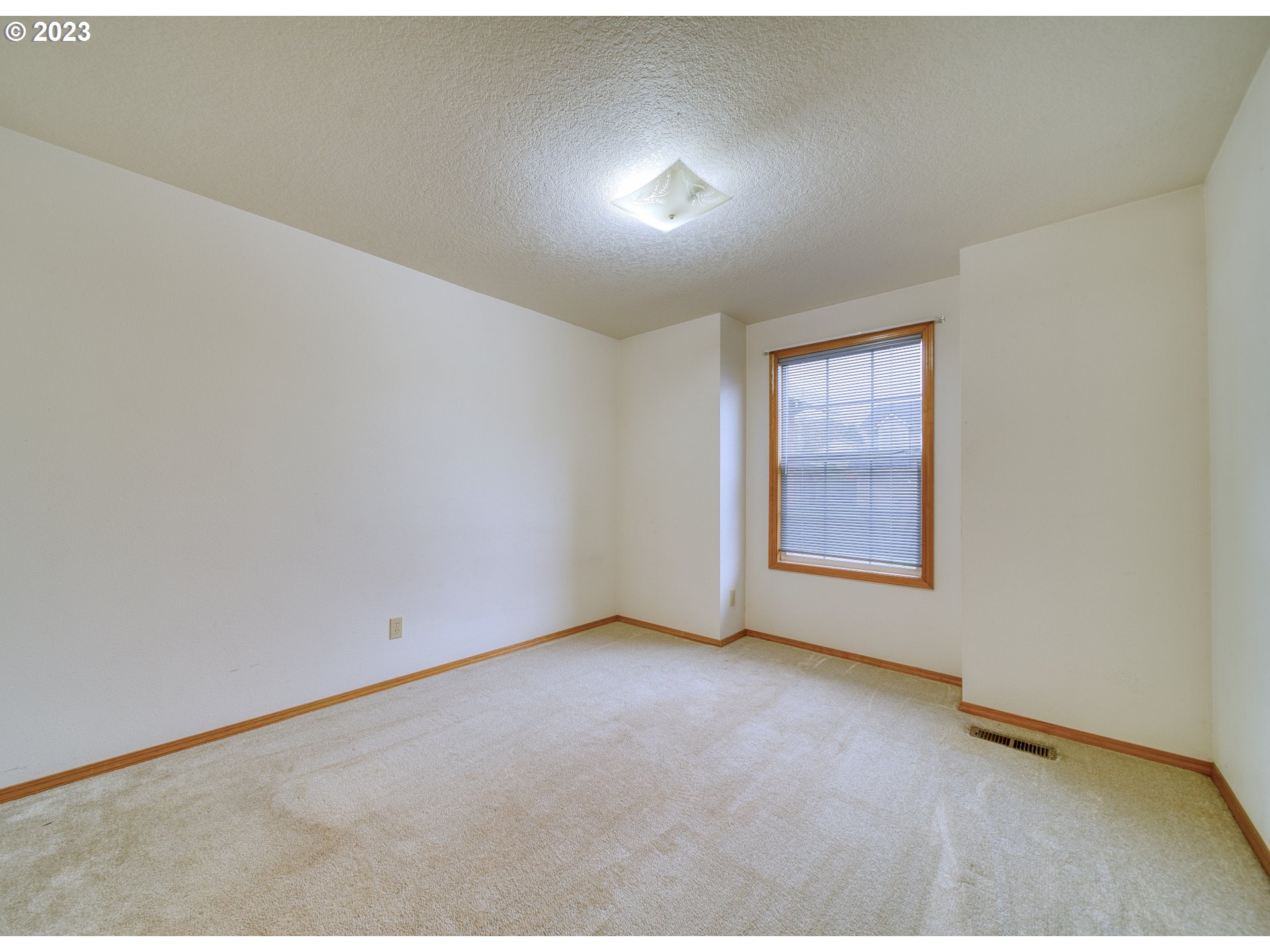 33912 Southeast Everett Way Scappoose, OR 97056 - Photo 13 of 32 an empty room with windows