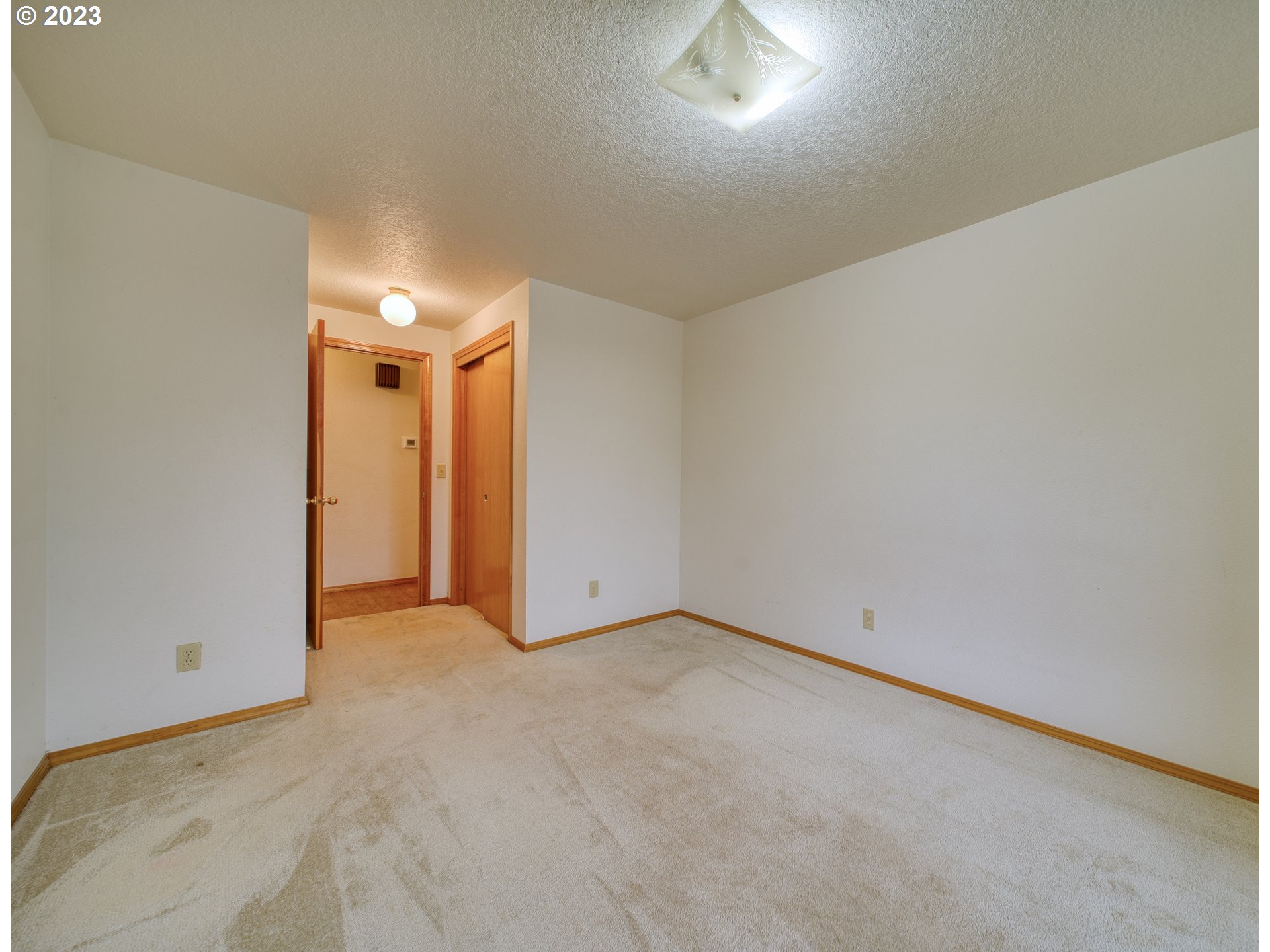 33912 Southeast Everett Way Scappoose, OR 97056 - Photo 14 of 32 an empty room with an entryway