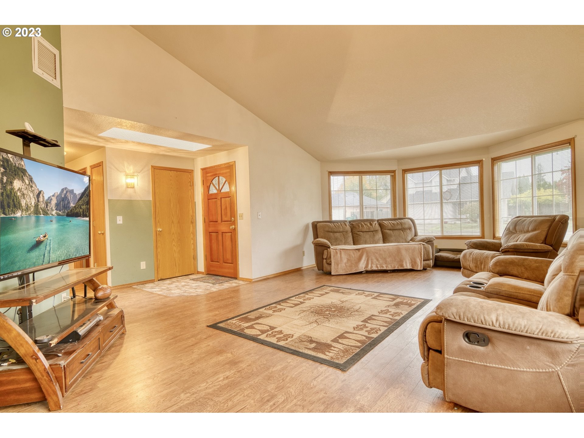 33912 Southeast Everett Way Scappoose, OR 97056 - Photo 5 of 32 a living room with furniture and a flat screen tv