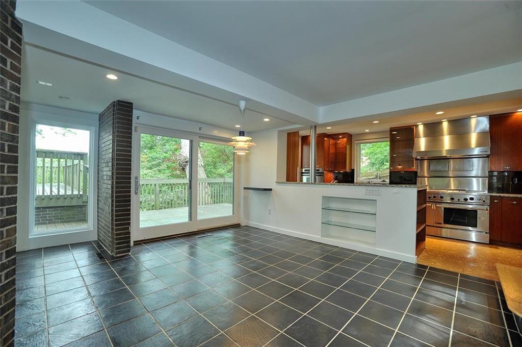 90 East Woodland Road Pittsburgh, PA 15232 - Photo 11 of 27 a room with a large window and kitchen view