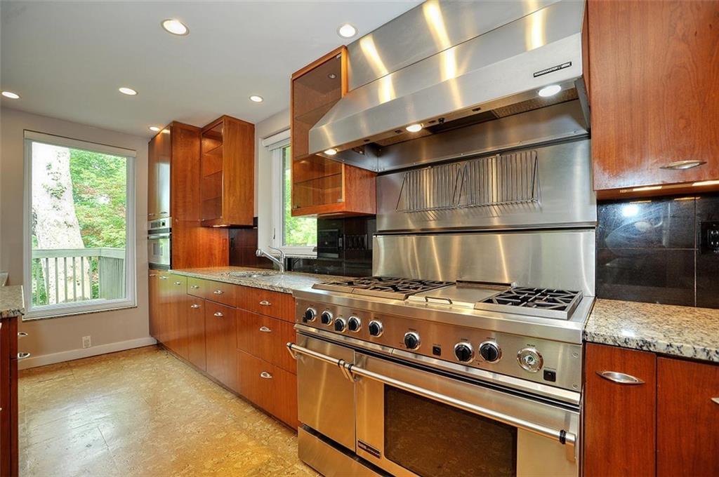 90 East Woodland Road Pittsburgh, PA 15232 - Photo 13 of 27 a kitchen with a stove and a refrigerator