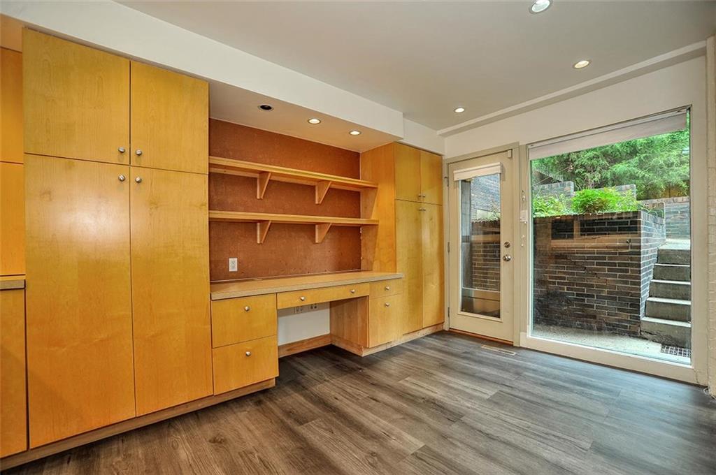 90 East Woodland Road Pittsburgh, PA 15232 - Photo 17 of 27 a view of an empty room with wooden floor and a window