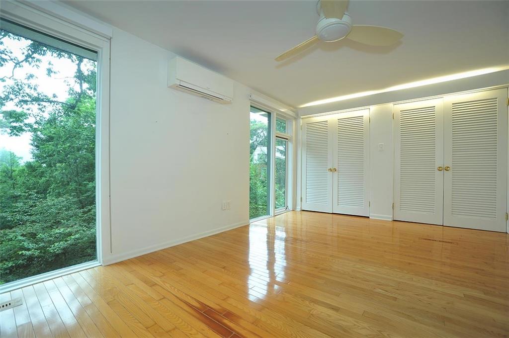 90 East Woodland Road Pittsburgh, PA 15232 - Photo 21 of 27 a view of an empty room with wooden floor and a window