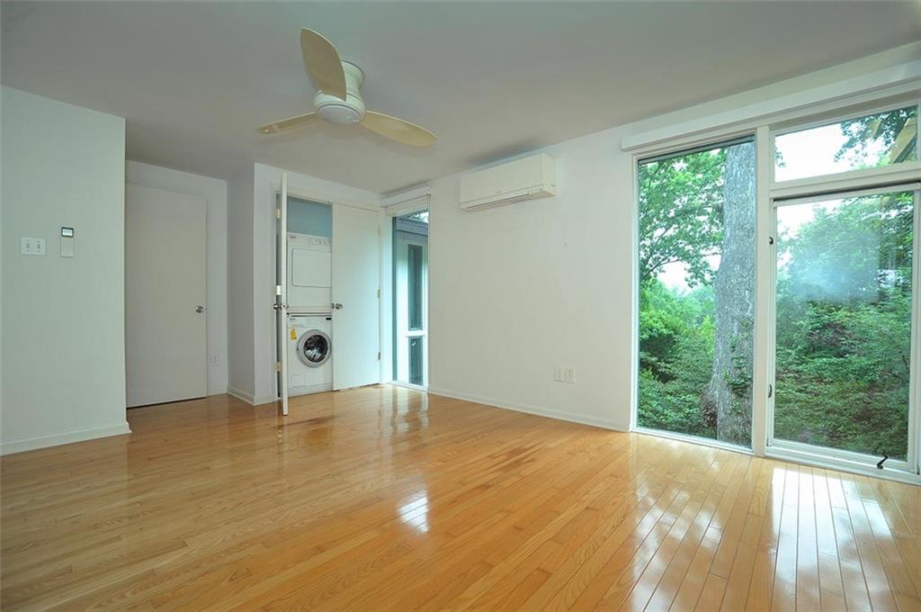 90 East Woodland Road Pittsburgh, PA 15232 - Photo 22 of 27 an empty room with wooden floor and windows