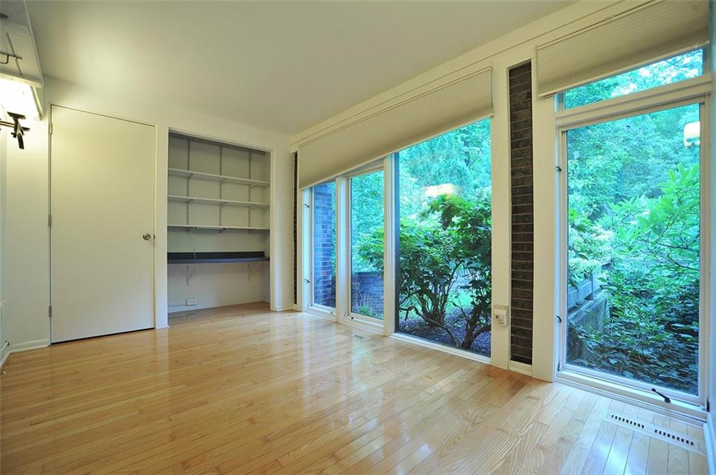 90 East Woodland Road Pittsburgh, PA 15232 - Photo 23 of 27 a view of a room with a large window and wooden floor