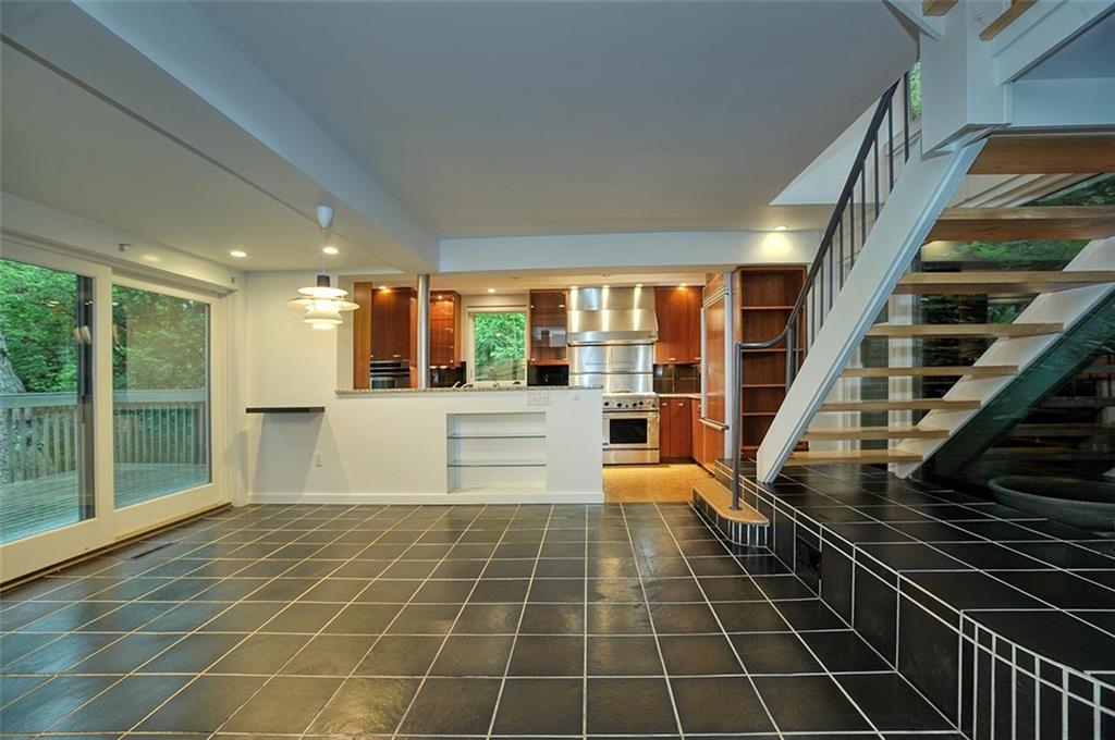 90 East Woodland Road Pittsburgh, PA 15232 - Photo 6 of 27 a view of an empty room with wooden floor and a window