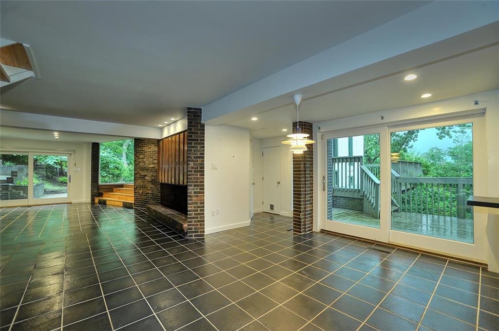 90 East Woodland Road Pittsburgh, PA 15232 - Photo 10 of 27 an empty room with floor to ceiling windows and an outdoor view