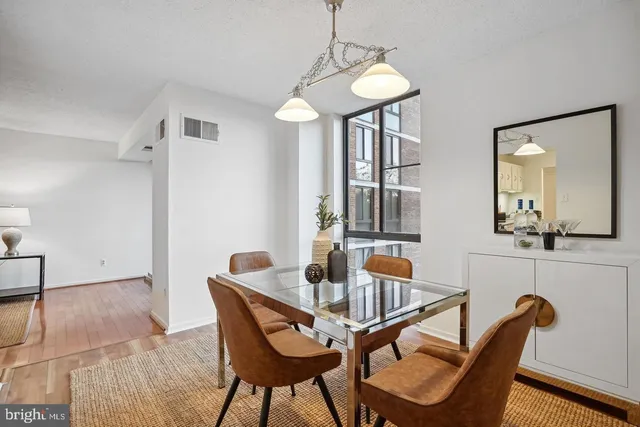 a dining room with furniture and window