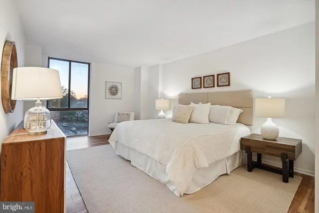 a bed room with a bed and a lamp