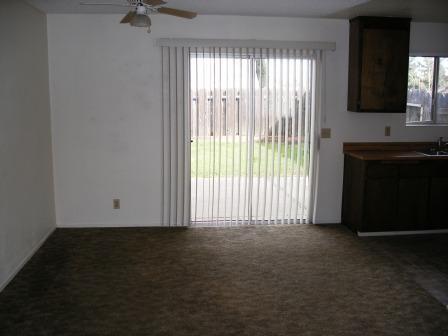1107 Beltline Road Redding, CA 96003 - Photo 3 of 8 a view of a room with a fireplace and a window