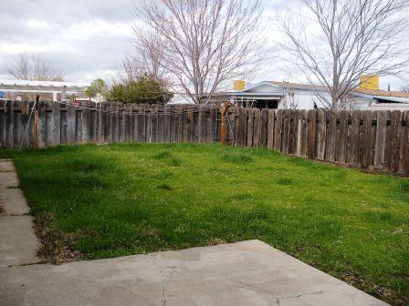 1107 Beltline Road Redding, CA 96003 - Photo 5 of 8 a view of a backyard with wooden fence