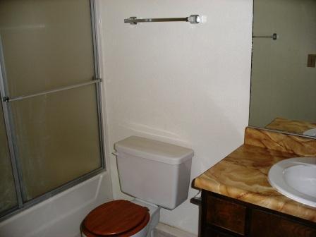 1107 Beltline Road Redding, CA 96003 - Photo 8 of 8 a bathroom with a sink toilet and vanity