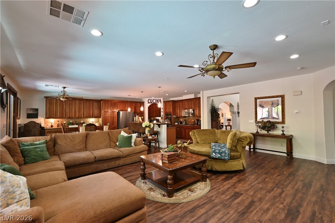 2729 Kildrummie Street Henderson, NV 89044 - Photo 20 of 42 An inviting open-concept living space features warm wood-look flooring and recessed lighting.