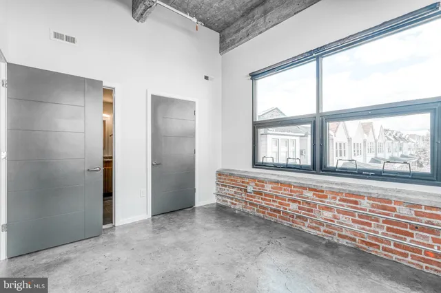 a view of an empty room with a window