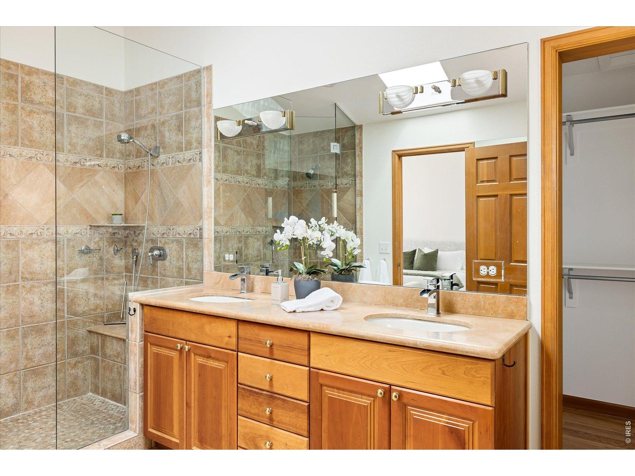 3966 Promontory Court Boulder, CO 80304 - Photo 16 of 42 a bathroom with a granite countertop sink mirror and double