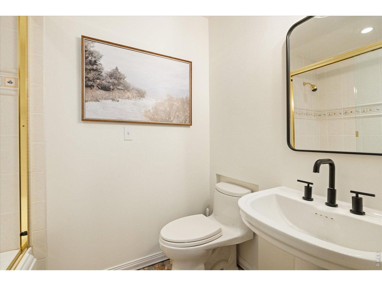 3966 Promontory Court Boulder, CO 80304 - Photo 21 of 42 a bathroom with a toilet sink and mirror