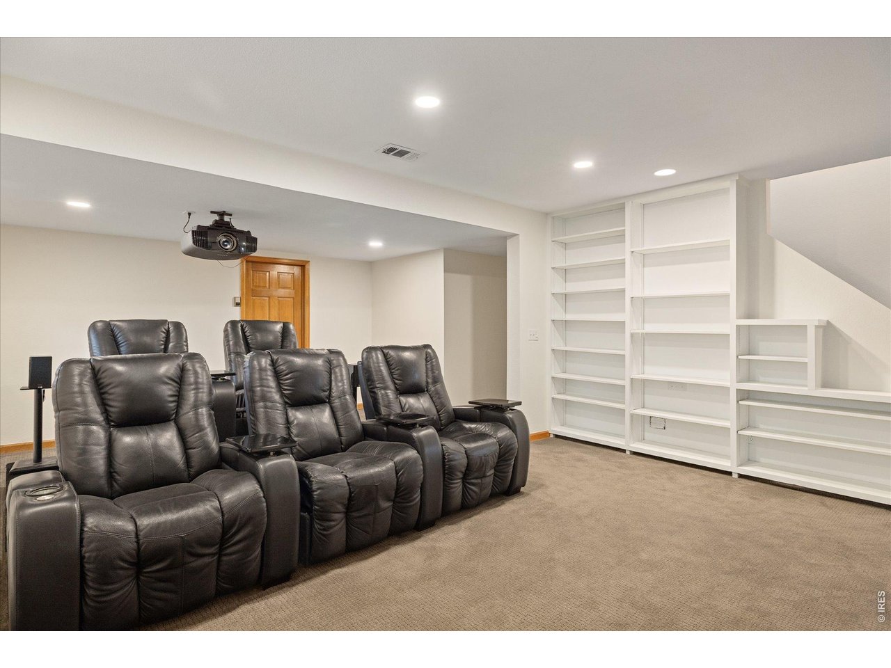 3966 Promontory Court Boulder, CO 80304 - Photo 22 of 42 a living room with furniture and a flat screen tv
