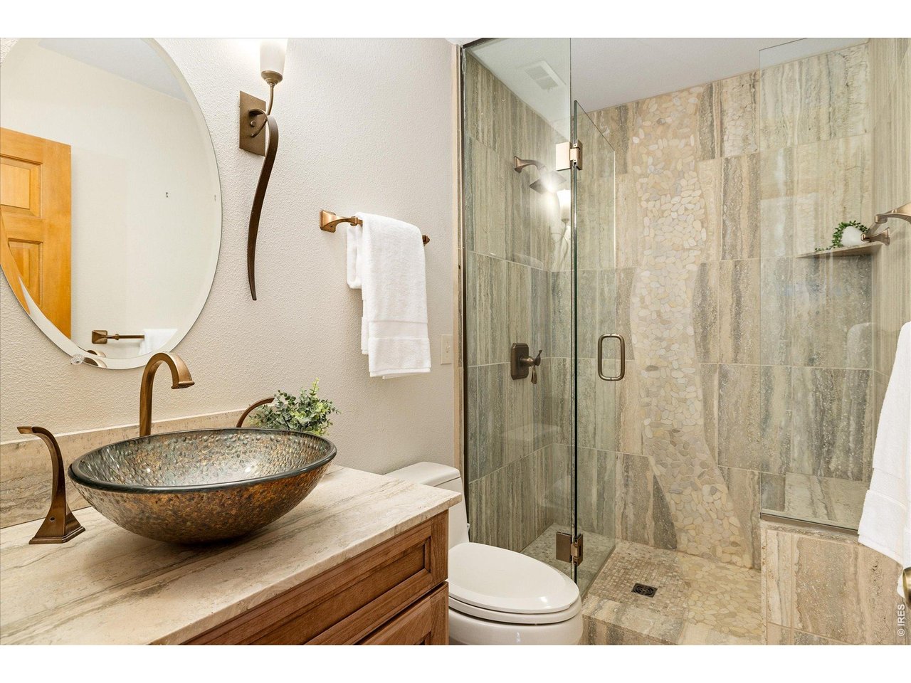 3966 Promontory Court Boulder, CO 80304 - Photo 28 of 42 a bathroom with a sink toilet and shower