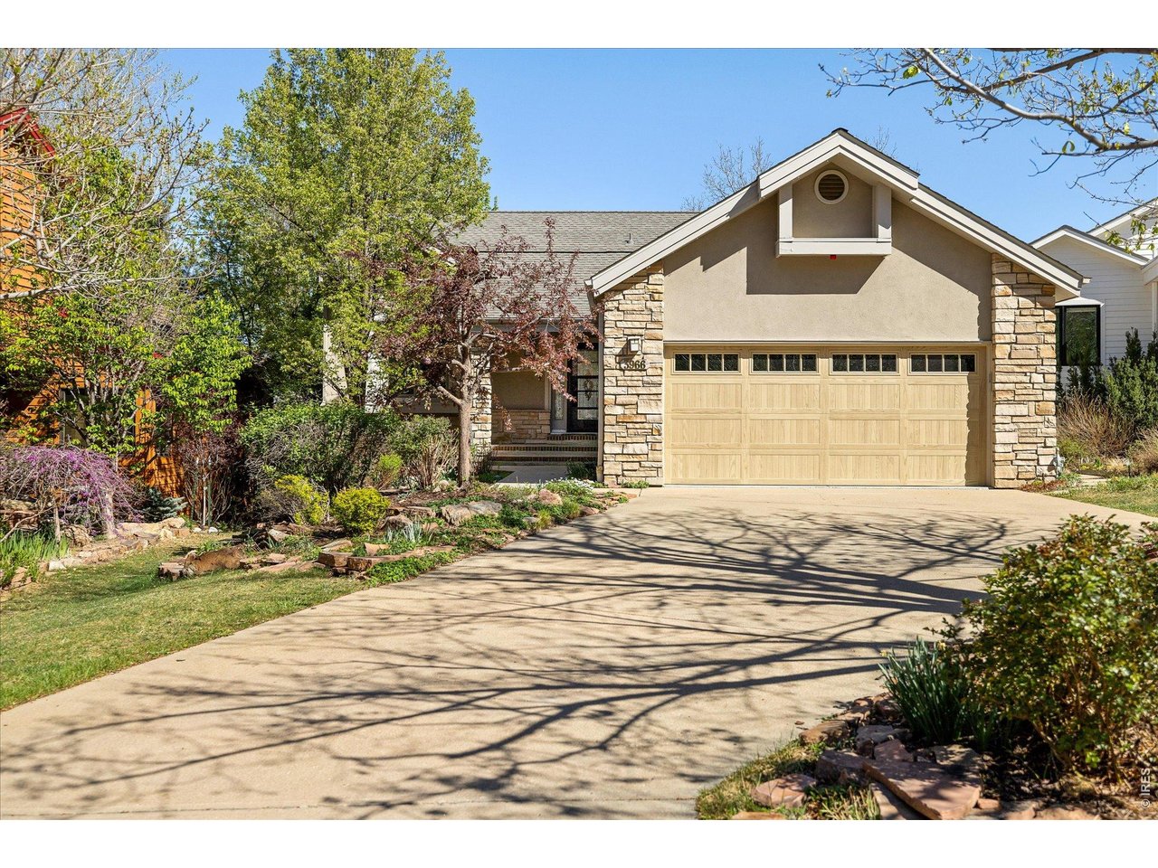 3966 Promontory Court Boulder, CO 80304 - Photo 3 of 42 a front view of a house with a yard