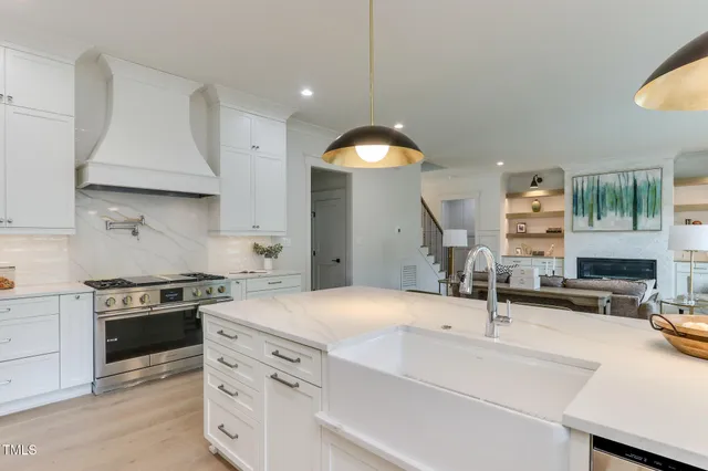 a kitchen with a sink stove and cabinets