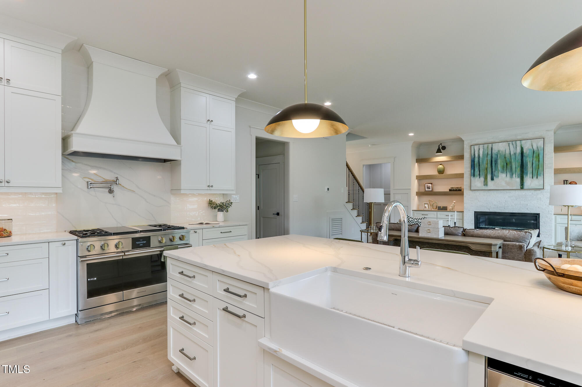 4921 Sweetbriar Drive Raleigh, NC 27609 - Photo 9 of 42 a kitchen with a sink stove and cabinets