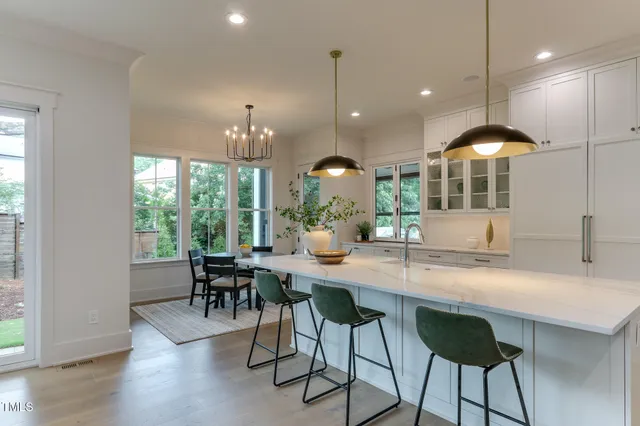 a kitchen with a table and chairs in it