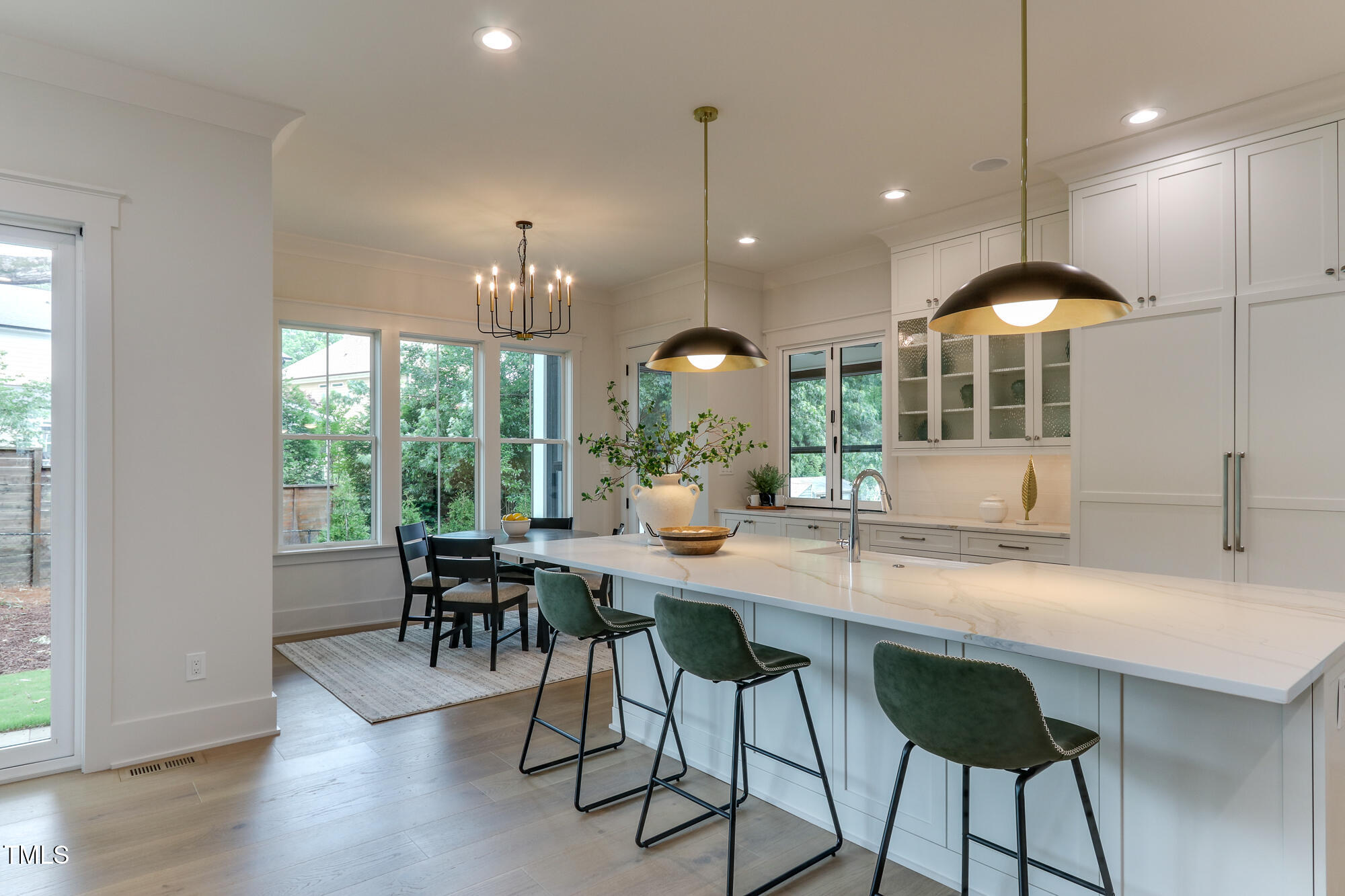 4921 Sweetbriar Drive Raleigh, NC 27609 - Photo 11 of 42 a kitchen with a table and chairs in it