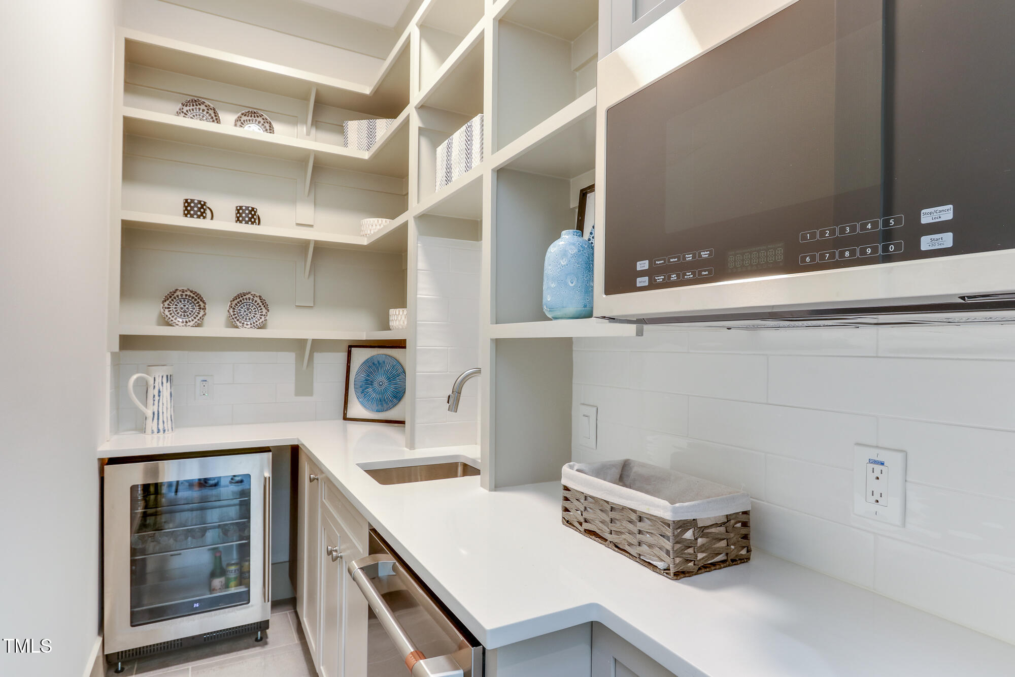 4921 Sweetbriar Drive Raleigh, NC 27609 - Photo 14 of 42 a kitchen with a stove and cabinets