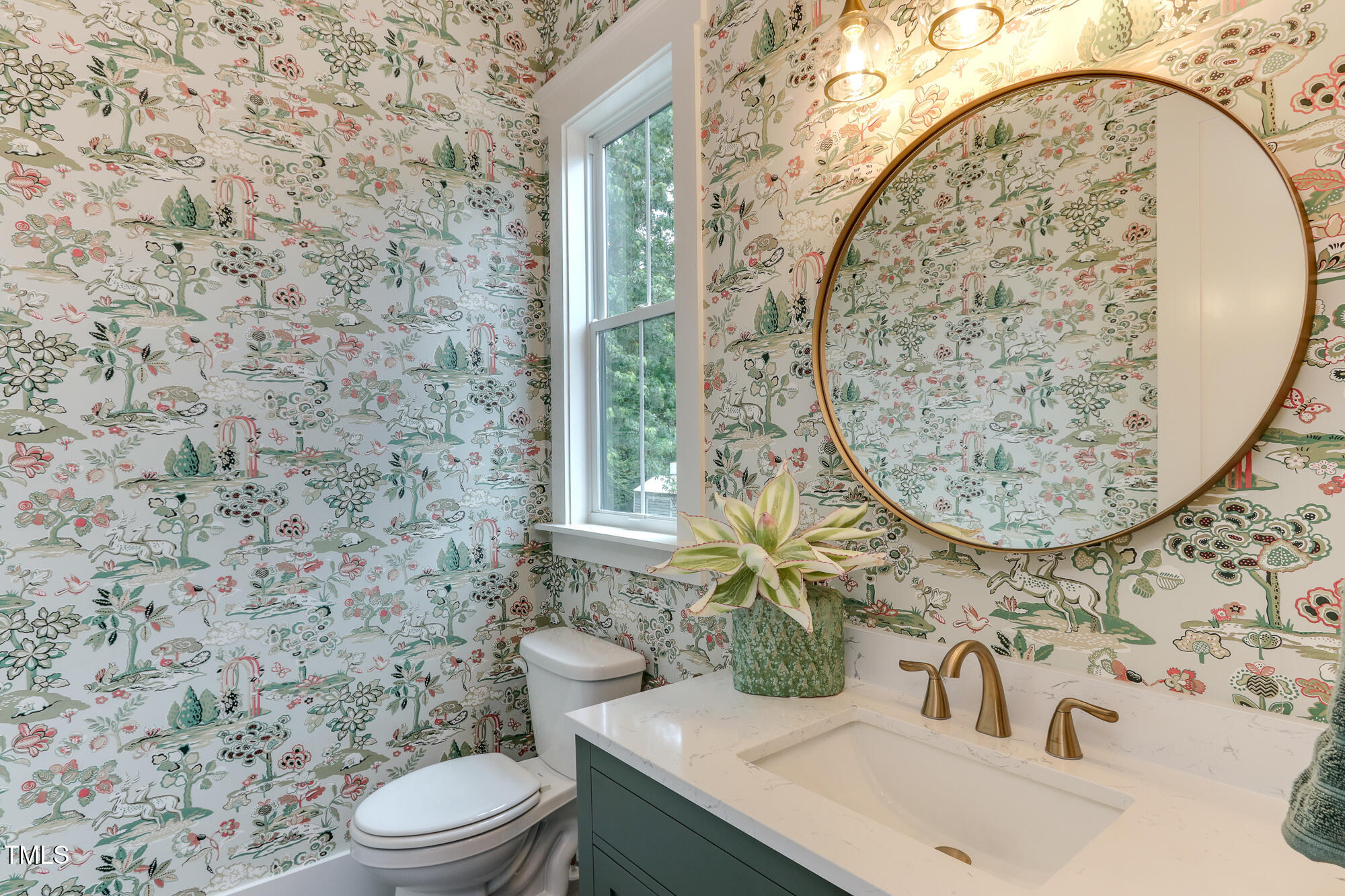 4921 Sweetbriar Drive Raleigh, NC 27609 - Photo 16 of 42 a bathroom with a sink and a mirror