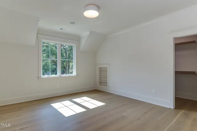 a bathroom with a sink toilet vanity and shower