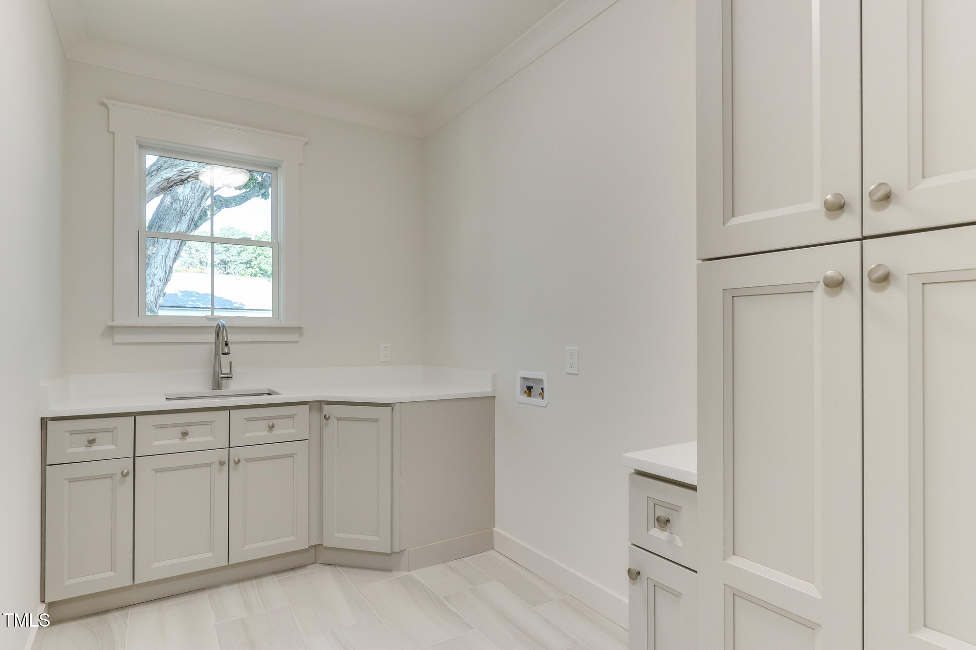 4921 Sweetbriar Drive Raleigh, NC 27609 - Photo 27 of 42 a view of a kitchen with white cabinets