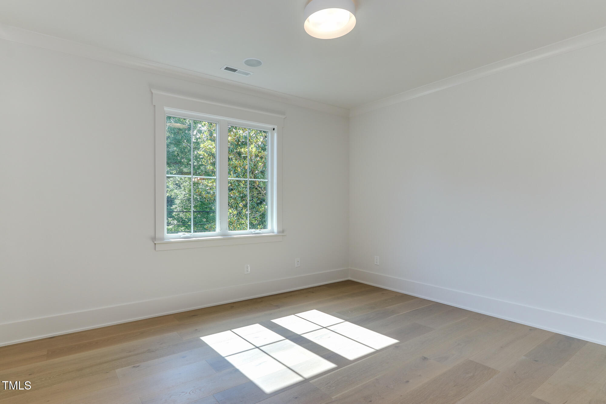 4921 Sweetbriar Drive Raleigh, NC 27609 - Photo 28 of 42 an empty room with a window