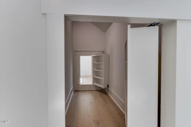 a bathroom with double sink and a mirror
