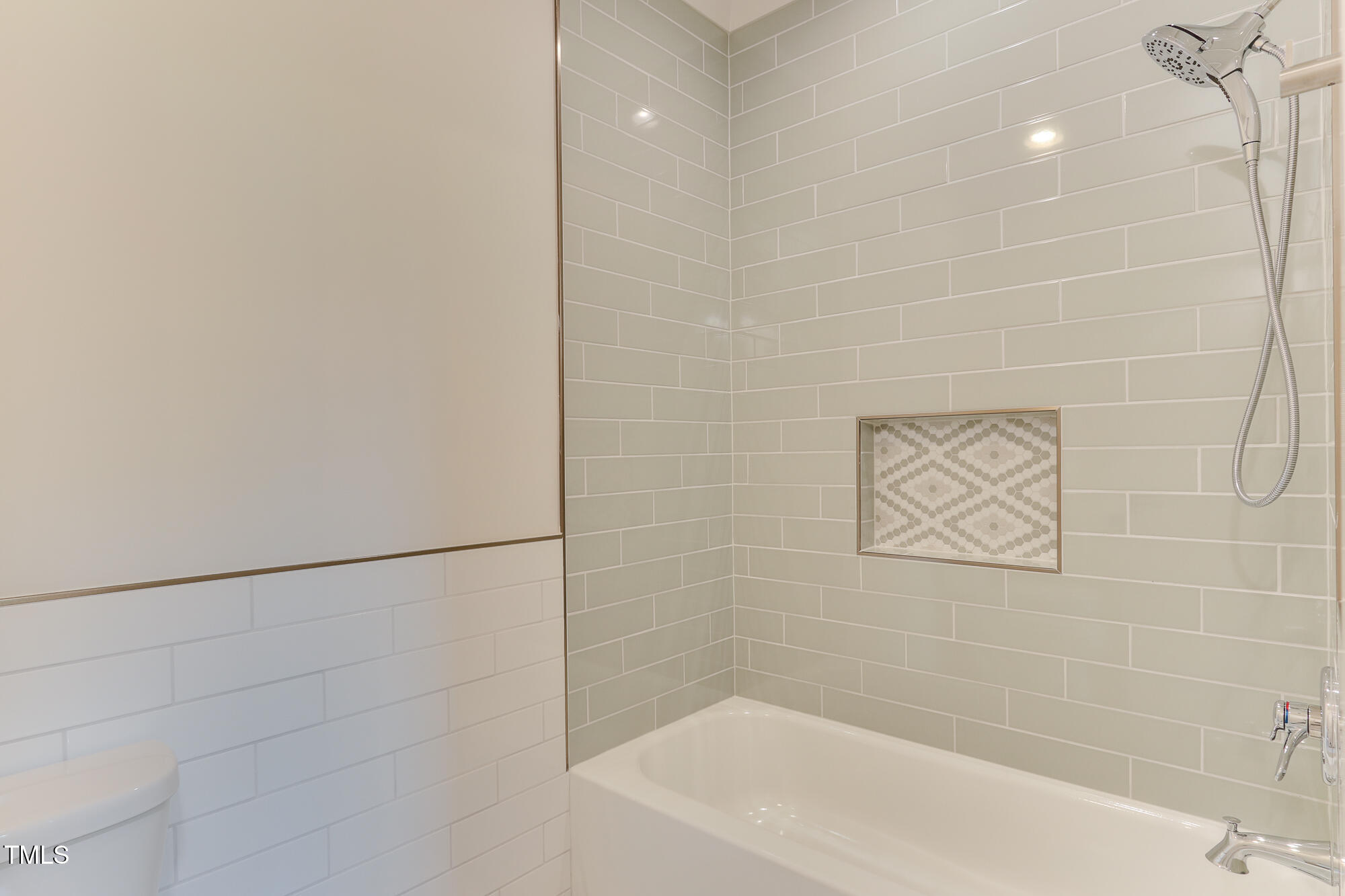 4921 Sweetbriar Drive Raleigh, NC 27609 - Photo 32 of 42 a bathroom with a bathtub