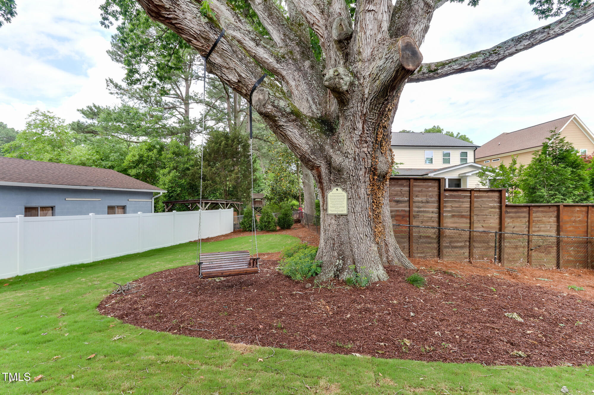 4921 Sweetbriar Drive Raleigh, NC 27609 - Photo 40 of 42 a view of a house with backyard and tree