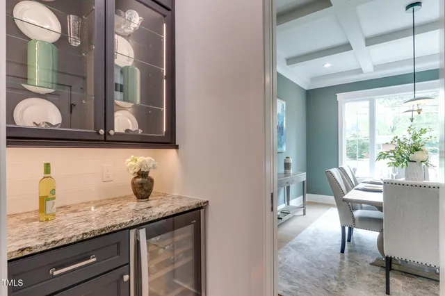 a kitchen with granite countertop a sink and cabinets