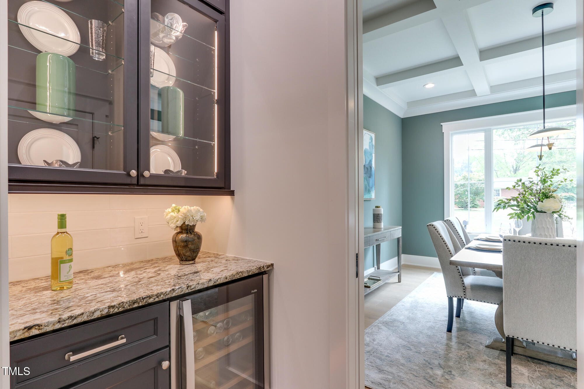 4921 Sweetbriar Drive Raleigh, NC 27609 - Photo 5 of 42 a kitchen with granite countertop a sink and cabinets