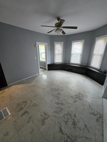 a view of empty room with windows